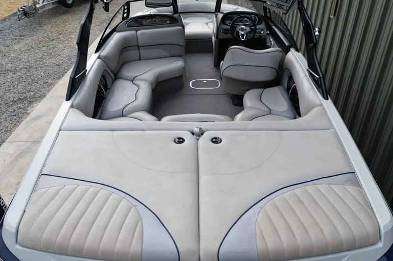 Slide: The Image of 2009 Malibu Wakesetter VTX boat interior with gray seating and sleek design. - 9