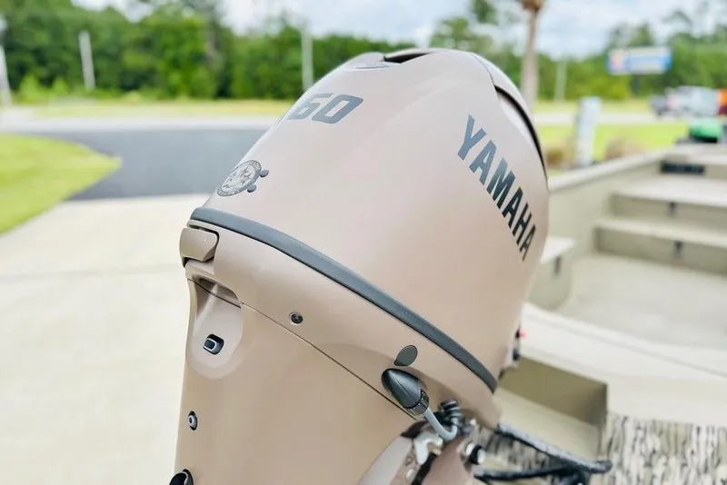 Slide: The Image of Yamaha outboard motor on Thor 1754 Timber Hammer, 2026 model, in a driveway setting. - 6