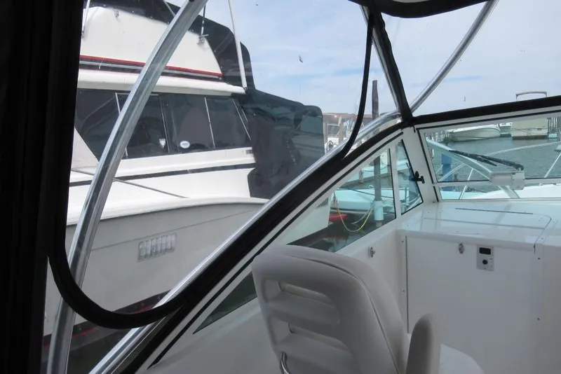 Slide: The Image of 2019 Albemarle 25 Express boat interior with marina view through windows. - 13