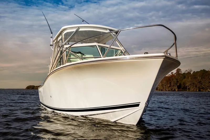 Slide: The Image of Manufacturer Provided Image: 2019 Albemarle 25 Express boat on water with fishing rods. - 21