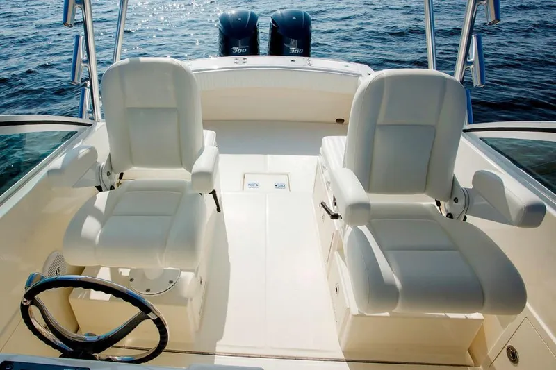 Slide: The Image of Manufacturer Provided Image: 2019 Albemarle 25 Express boat interior with twin seats and dual outboard motors. - 24