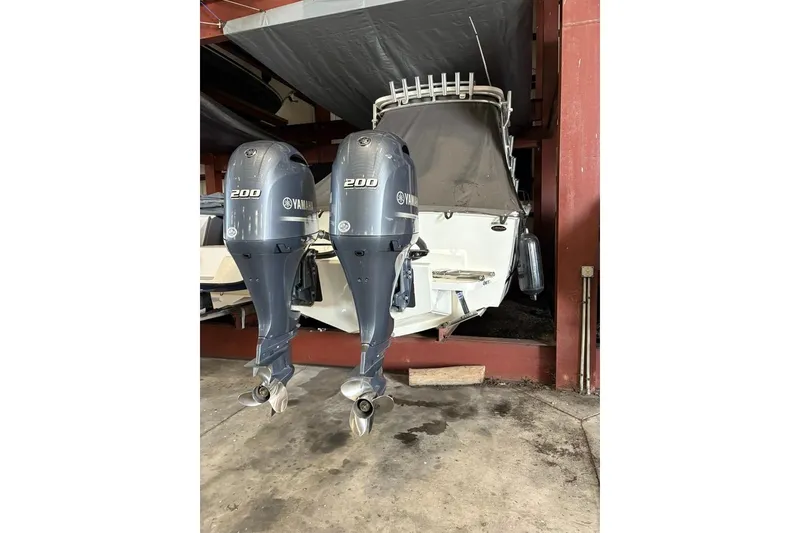 Slide: The Image of 2019 Albemarle 25 Express boat with twin Yamaha 200 engines in storage. - 4