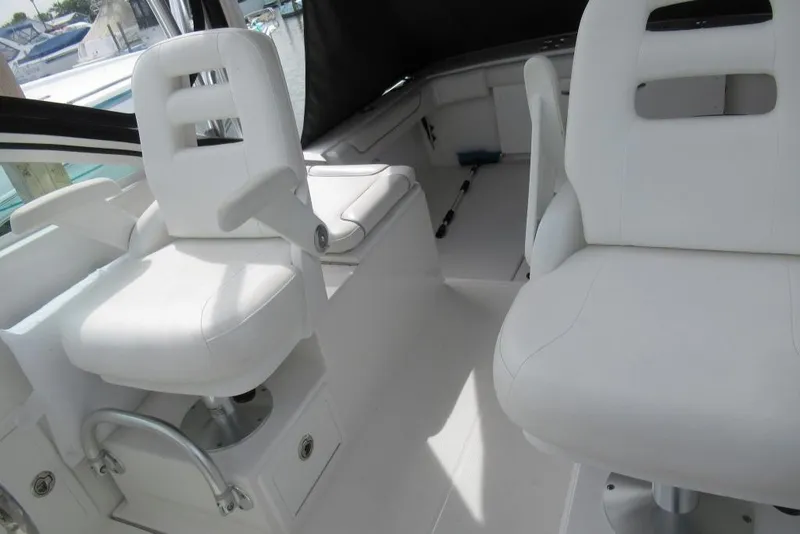 Slide: The Image of 2019 Albemarle 25 Express boat interior with white seating and modern design. - 7