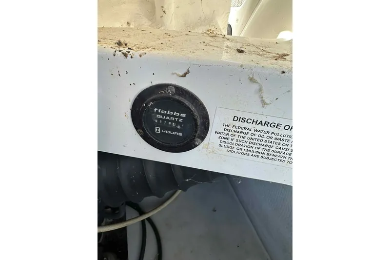 Slide: The Image of Hobbs Quartz hour meter on a 2005 Cobalt 262 boat dashboard. - 12