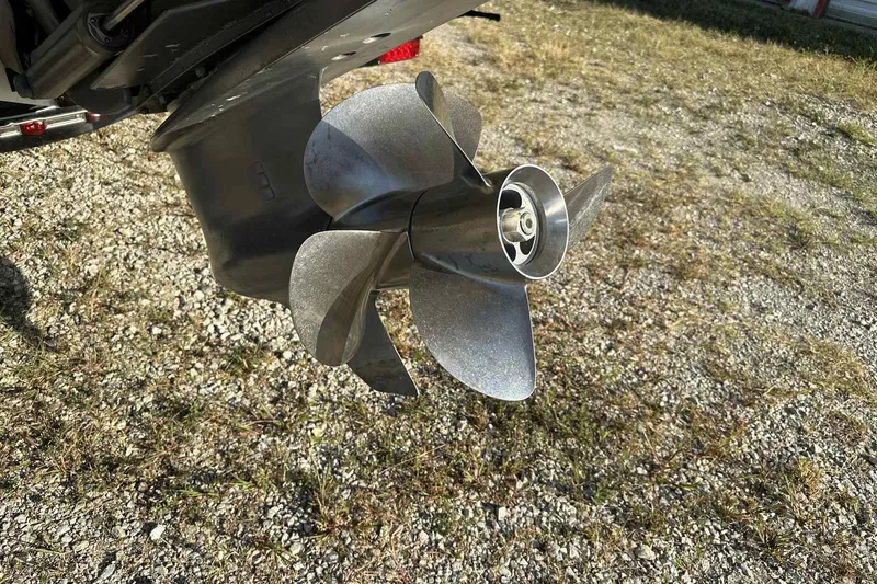 Slide: The Image of Boat propeller of a 2005 Cobalt 262 on gravel surface. - 4