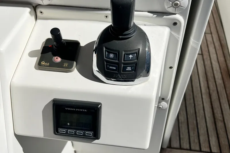 Slide: The Image of Control panel of a 2014 Beneteau Swift Trawler 50 with joystick and Volvo Penta display. - 11
