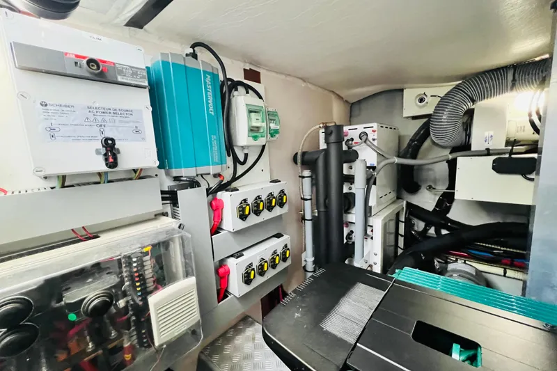 Slide: The Image of Engine room of a 2014 Beneteau Swift Trawler 50, showcasing electrical systems and components. - 17