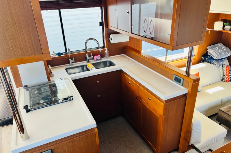 Slide: The Image of Luxurious kitchen interior of 2014 Beneteau Swift Trawler 50 with modern amenities. - 25