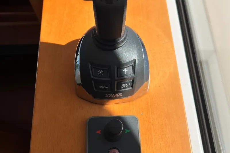 Slide: The Image of Control panel of a 2014 Beneteau Swift Trawler 50 with Volvo Penta joystick. - 32