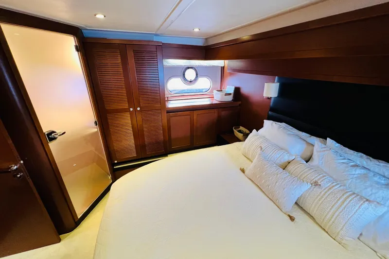 Slide: The Image of Luxurious cabin interior of 2014 Beneteau Swift Trawler 50 with elegant wood finishes. - 36
