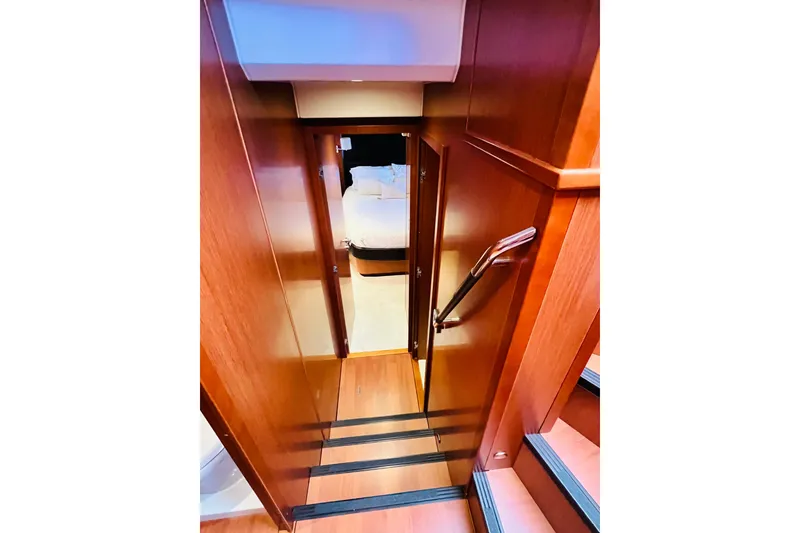 Slide: The Image of Stairway leading to cabin in 2014 Beneteau Swift Trawler 50 yacht interior. - 39