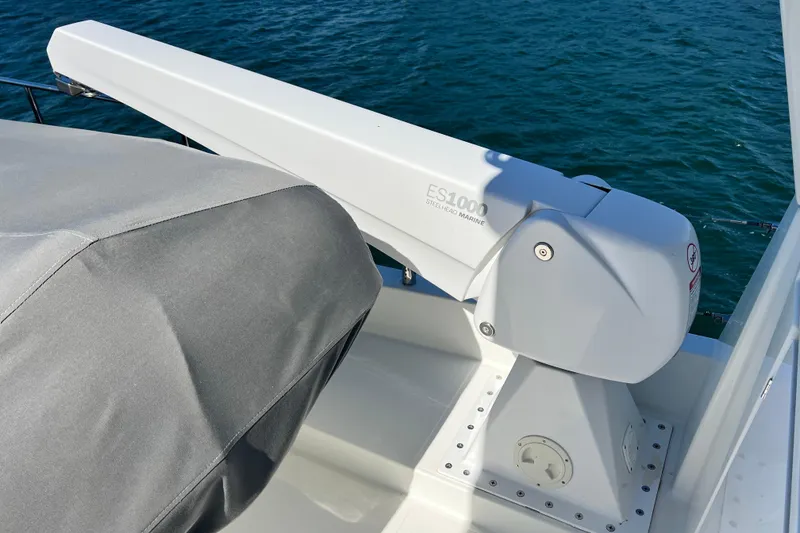 Slide: The Image of Steelhead Marine ES1000 crane on 2014 Beneteau Swift Trawler 50, docked on calm water. - 49