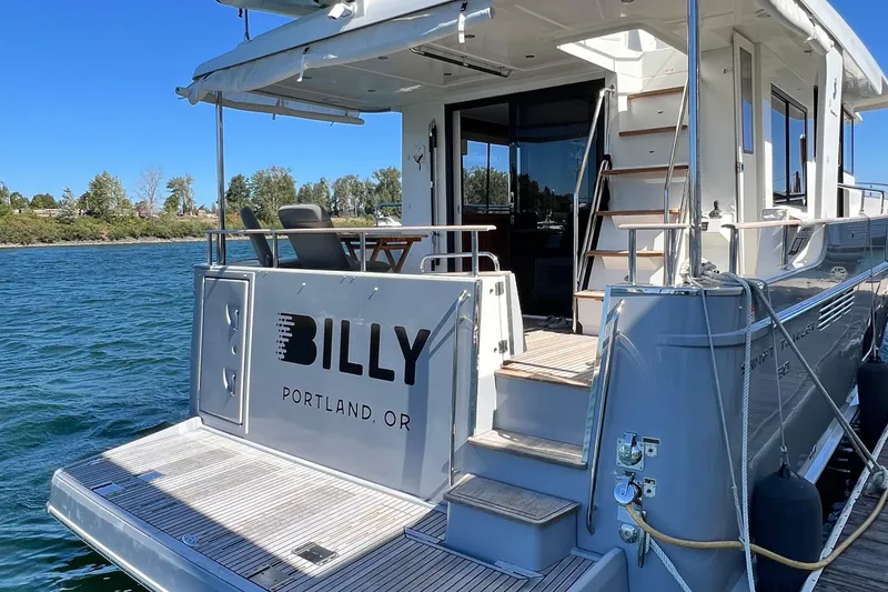 Slide: The Image of 2014 Beneteau Swift Trawler 50 docked, featuring "BILLY" from Portland, OR. - 8