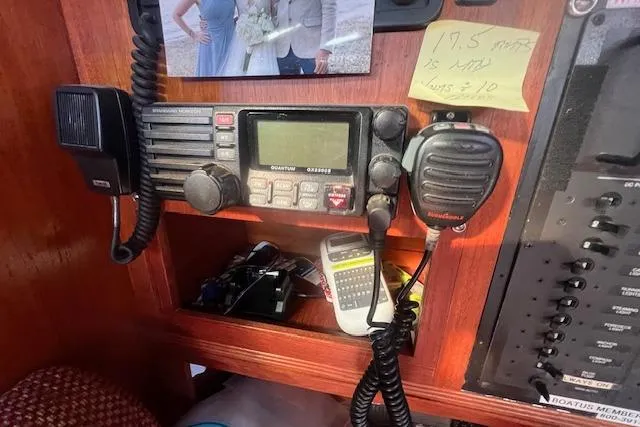 Slide: The Image of 1987 Sabre 42 K/CB yacht radio equipment with microphone and control panel. - 10