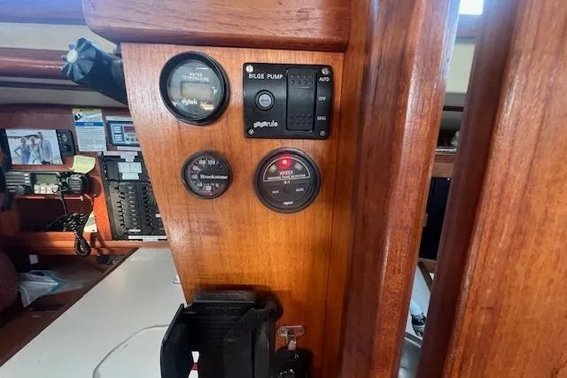 Slide: The Image of Control panel of a 1987 Sabre 42 K/CB sailboat with gauges and switches. - 11