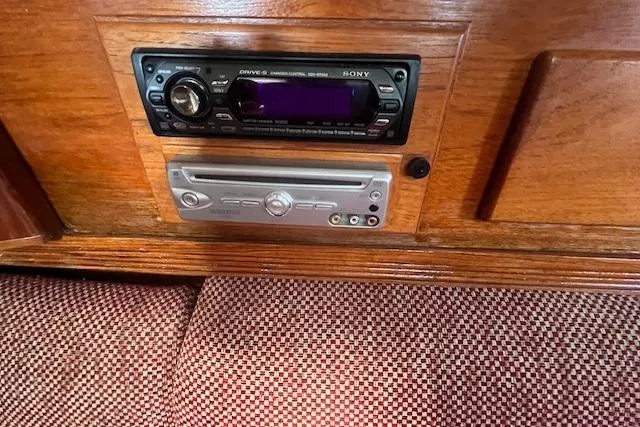 Slide: The Image of 1987 Sabre 42 K/CB interior with Sony stereo and wood paneling. - 13