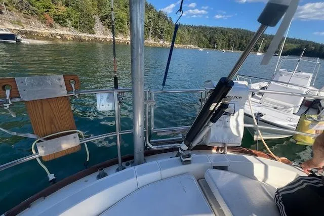 Slide: The Image of 1987 Sabre 42 K/CB sailboat on serene lake with forested shoreline. - 15