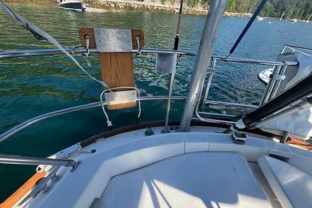 Slide: The Image of 1987 Sabre 42 K/CB sailboat deck with scenic water and shoreline view. - 16