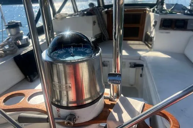 Slide: The Image of Cockpit view of 1987 Sabre 42 K/CB sailboat with compass and steering wheel. - 18