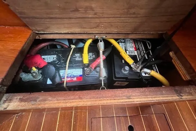 Slide: The Image of Battery compartment of a 1987 Sabre 42 K/CB sailboat with visible wiring. - 27