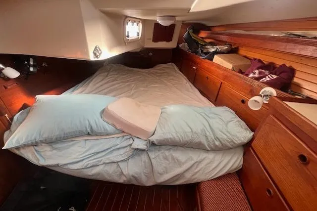 Slide: The Image of Cozy cabin interior of 1987 Sabre 42 K/CB sailboat with bed and wooden storage. - 8
