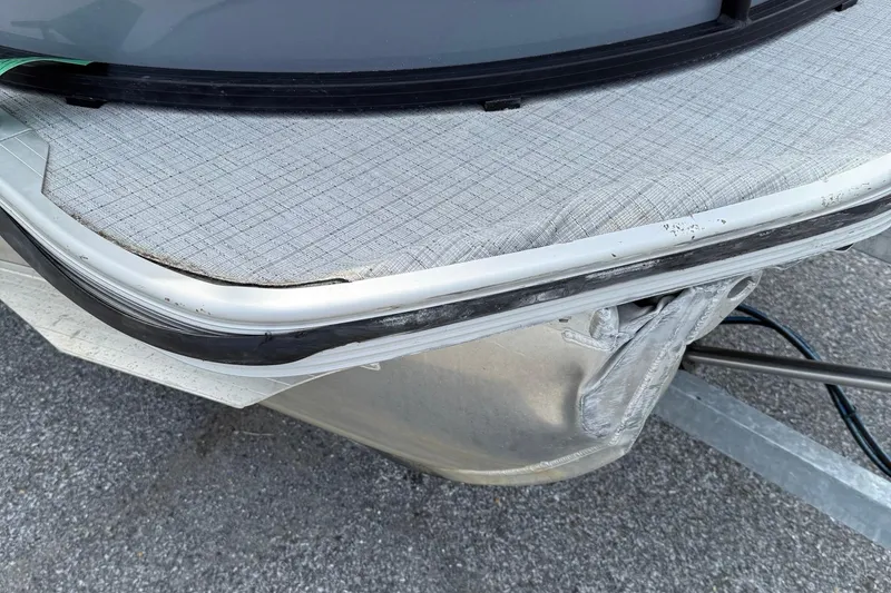 Slide: The Image of 2025 Berkshire 24E CTS 2.75 boat corner detail with textured surface and metal trim. - 17