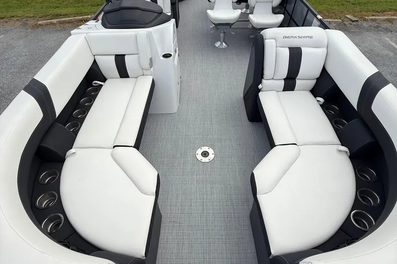 Slide: The Image of 2025 Berkshire 24E CTS 2.75 pontoon boat interior with white and black seating. - 8