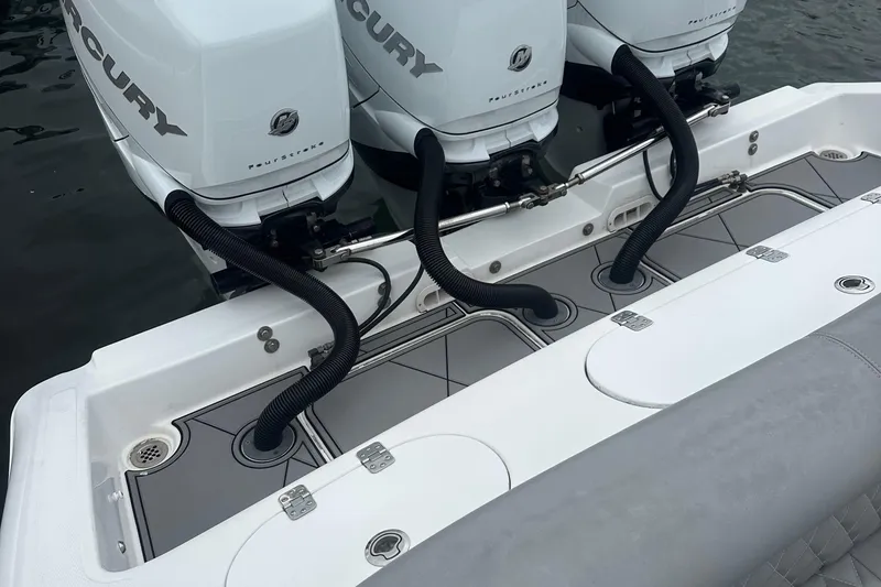 Slide: The Image of 2016 Midnight Express 37 Open boat with triple Mercury outboard engines. - 10