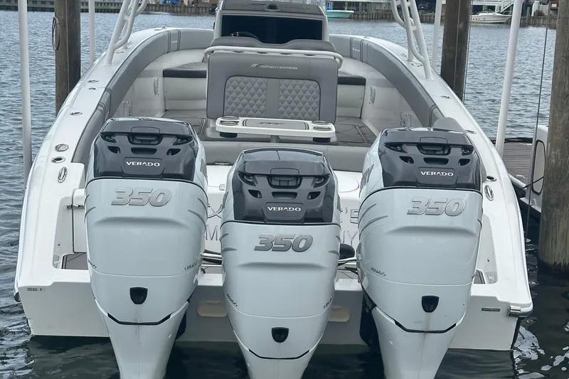 Slide: The Image of 2016 Midnight Express 37 Open boat with triple Verado 350 engines docked. - 12