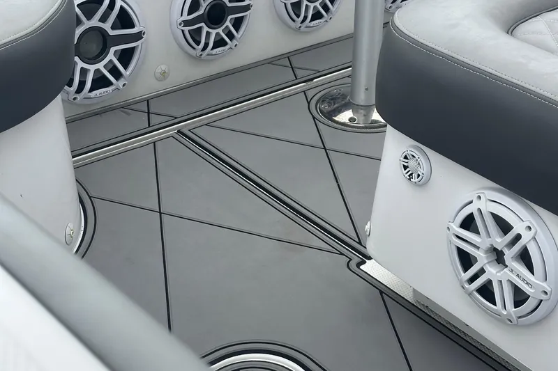 Slide: The Image of Interior of 2016 Midnight Express 37 Open boat with JL Audio speakers and cushioned seating. - 14