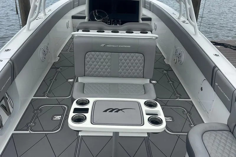 Slide: The Image of 2016 Midnight Express 37 Open boat interior with gray seating and sleek design. - 3