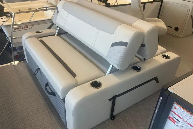 Slide: The Image of 2025 Crest 240 Classic LX SLSC boat interior with luxurious seating and cup holders. - 5