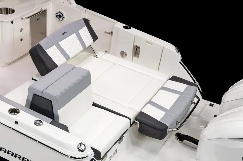 Slide: The Image of 2026 Chaparral 310 OSX boat interior with luxurious seating and modern design. - 23