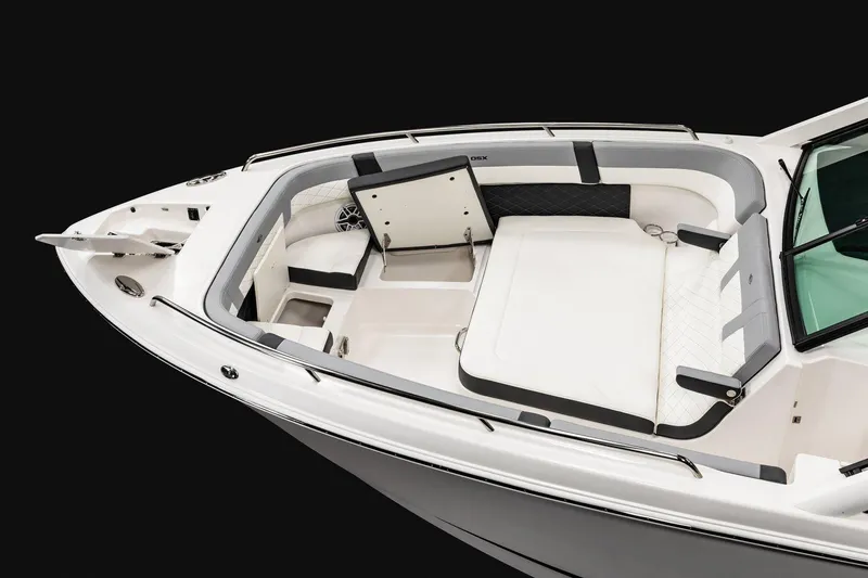 Slide: The Image of 2026 Chaparral 310 OSX boat interior with luxurious seating and sleek design. - 4