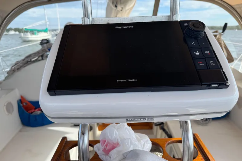Slide: The Image of Raymarine navigation system on 1988 Nonsuch 36 sailboat, with ocean view in background. - 12