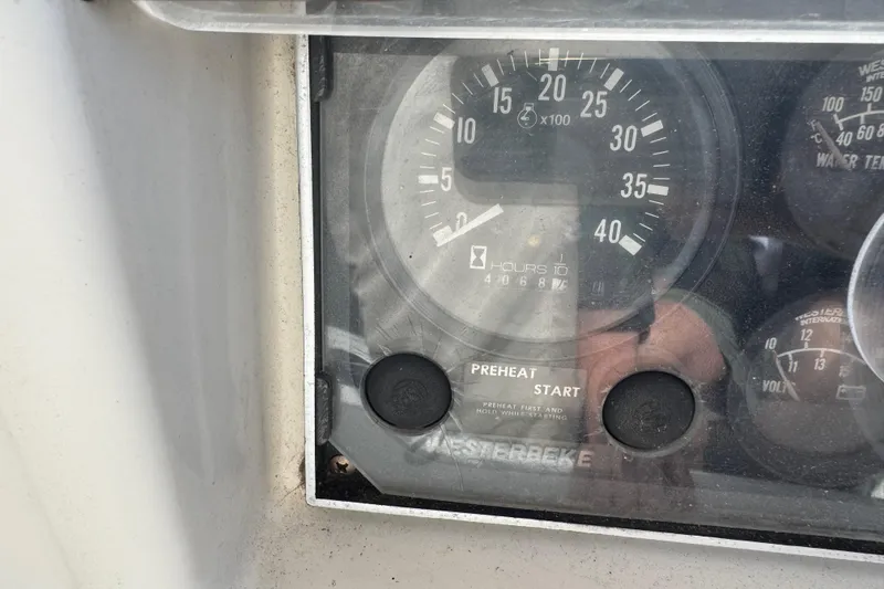 Slide: The Image of Dashboard of a 1988 Nonsuch 36 sailboat showing engine hours and gauges. - 14