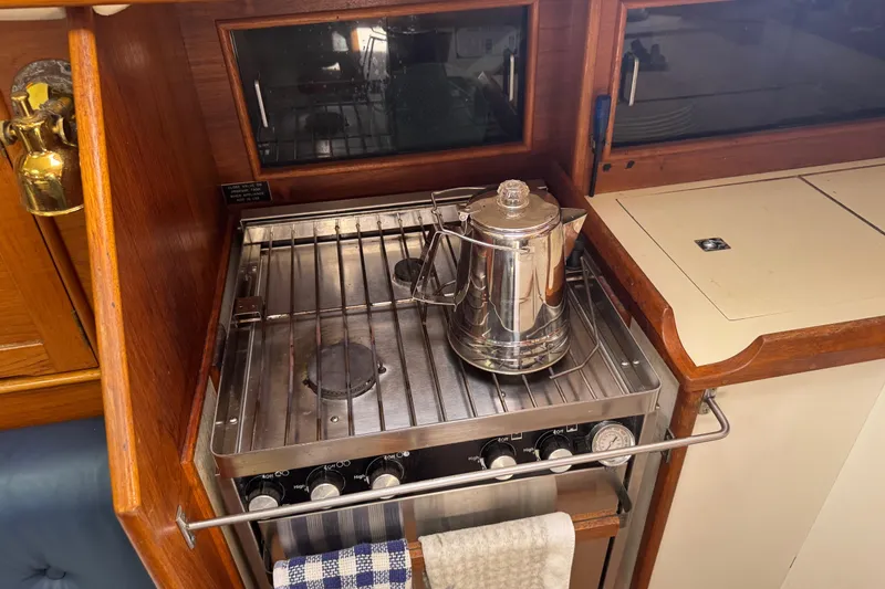 Slide: The Image of Stainless steel kettle on stove in 1988 Nonsuch 36 yacht galley. - 24