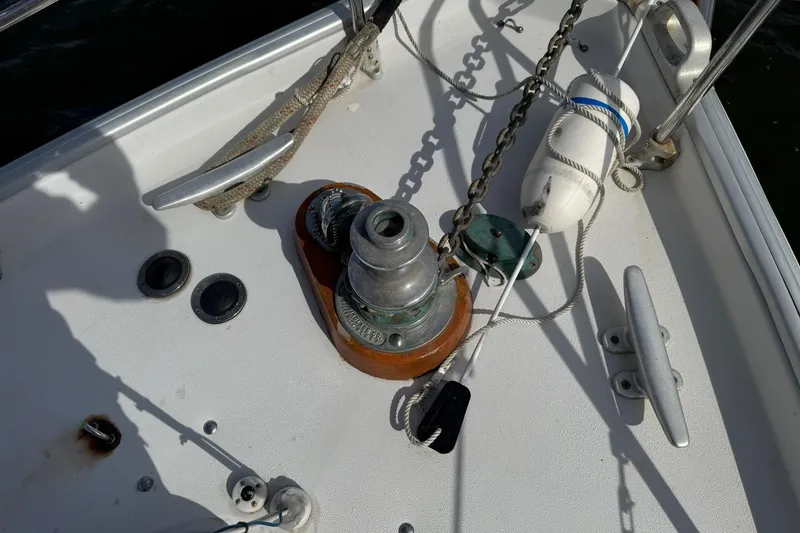 Slide: The Image of Deck of 1988 Nonsuch sailboat with winch, cleats, and fender. - 7
