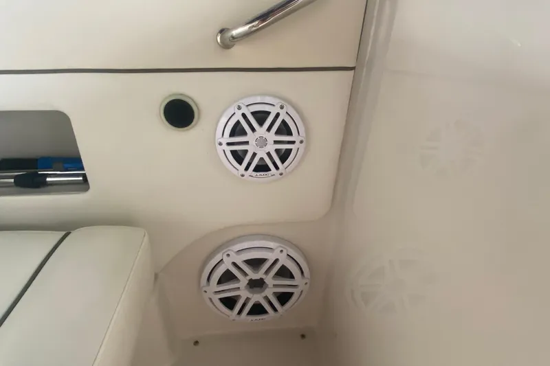 Slide: The Image of 2008 Sea Ray 290 Sundeck interior with JL Audio speakers and cushioned seating. - 10