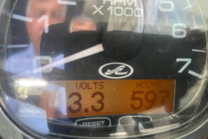 Slide: The Image of Close-up of a 2008 Sea Ray 290 Sundeck gauge showing 3.3 volts and 597 hours. - 19