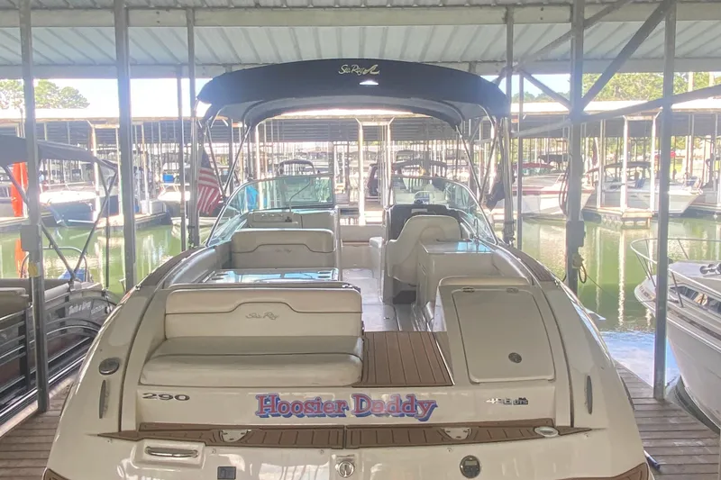 Slide: The Image of 2008 Sea Ray 290 Sundeck boat docked in a marina, rear view. - 6