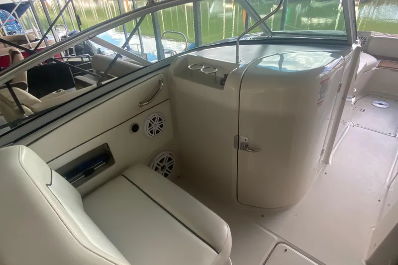 Slide: The Image of 2008 Sea Ray 290 Sundeck interior with seating and storage compartments. - 9