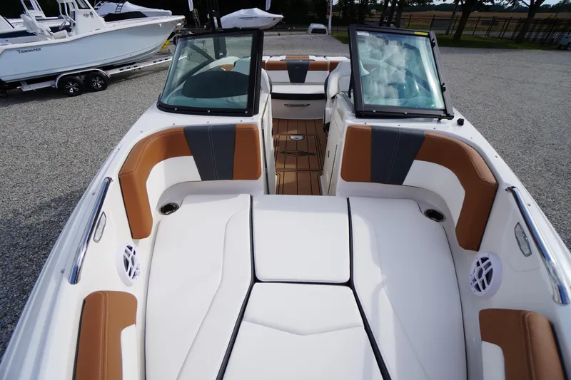 Slide: The Image of 2026 Chaparral 21 SSi boat interior with tan and white seating, open windshield. - 11