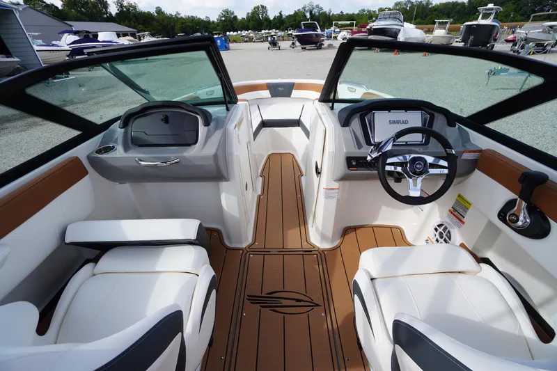 Slide: The Image of 2026 Chaparral 21 SSi boat interior with modern dashboard and seating. - 15