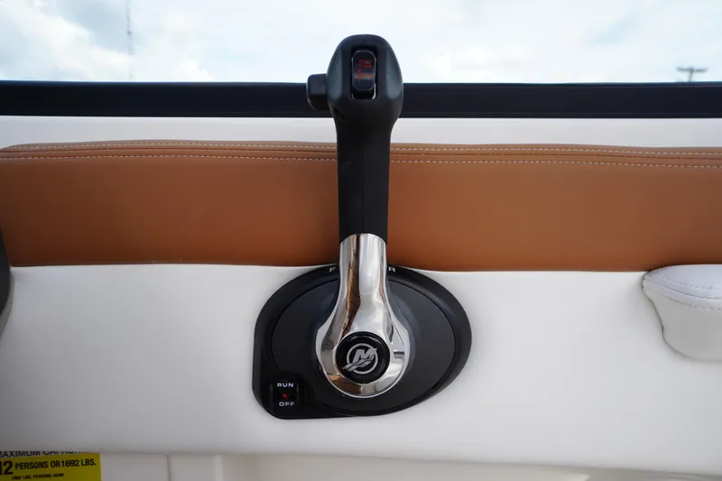 Slide: The Image of Throttle control of 2026 Chaparral 21 SSi boat, featuring sleek design and ergonomic handle. - 21