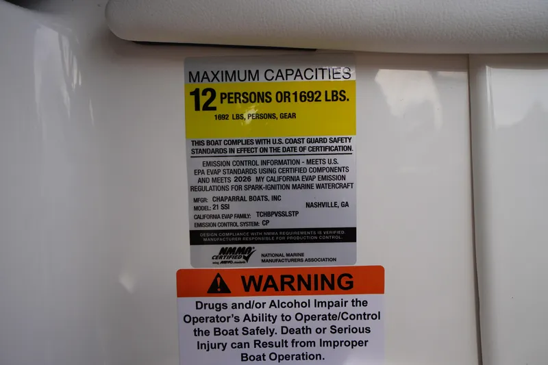 Slide: The Image of 2026 Chaparral 21 SSi capacity label, 12 persons or 1692 lbs, safety compliance. - 22