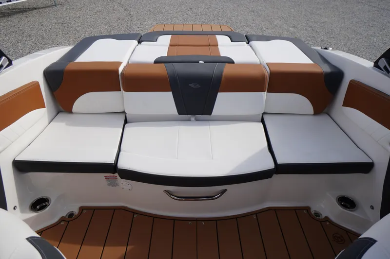 Slide: The Image of 2026 Chaparral 21 SSi boat interior with stylish brown and white seating. - 26
