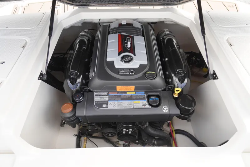 Slide: The Image of 2026 Chaparral 21 SSi boat engine compartment with Mercury 4.5L 250 HP engine. - 34