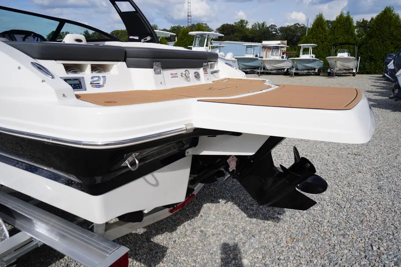 Slide: The Image of 2026 Chaparral 21 SSi boat rear view with swim platform and outboard motor. - 39