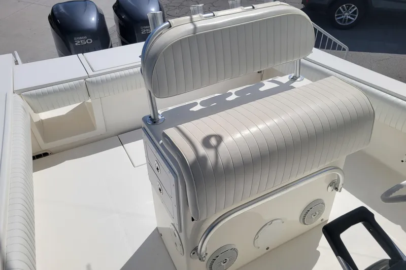 Slide: The Image of 2006 Regulator 29 Forward Seating boat interior with Yamaha 250 engines, featuring cushioned seating. - 5